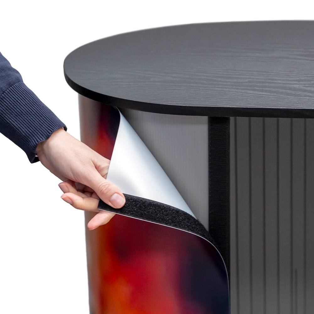 Printed graphic being attached to the large curved counter