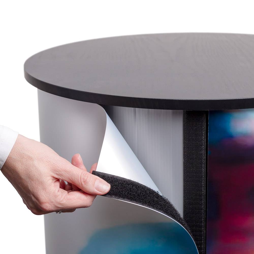 Printed graphic being attached to the round counter